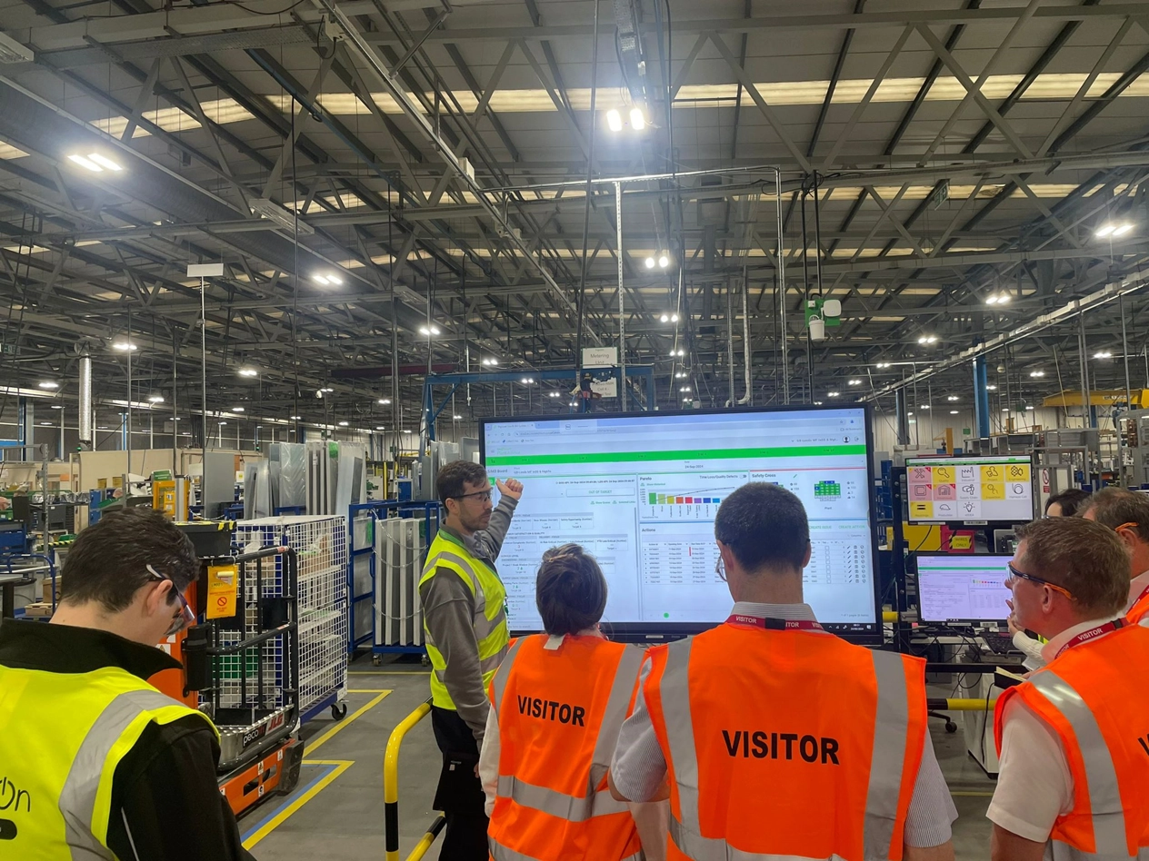 Judges looking at dashboards judging manufacturing excellence at a UK smart factory