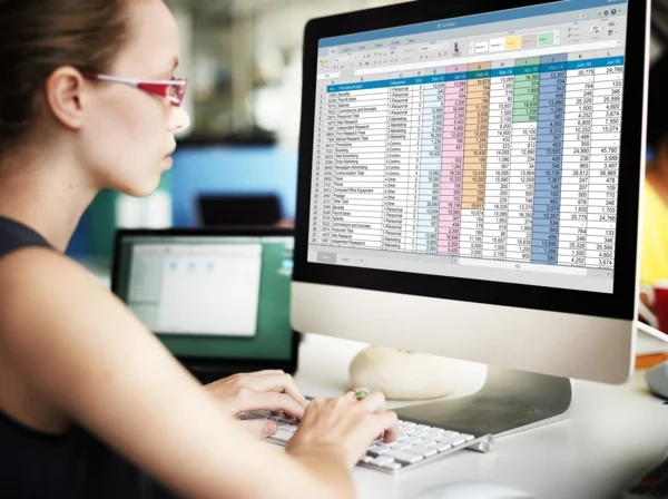 A woman working on a spreadsheet